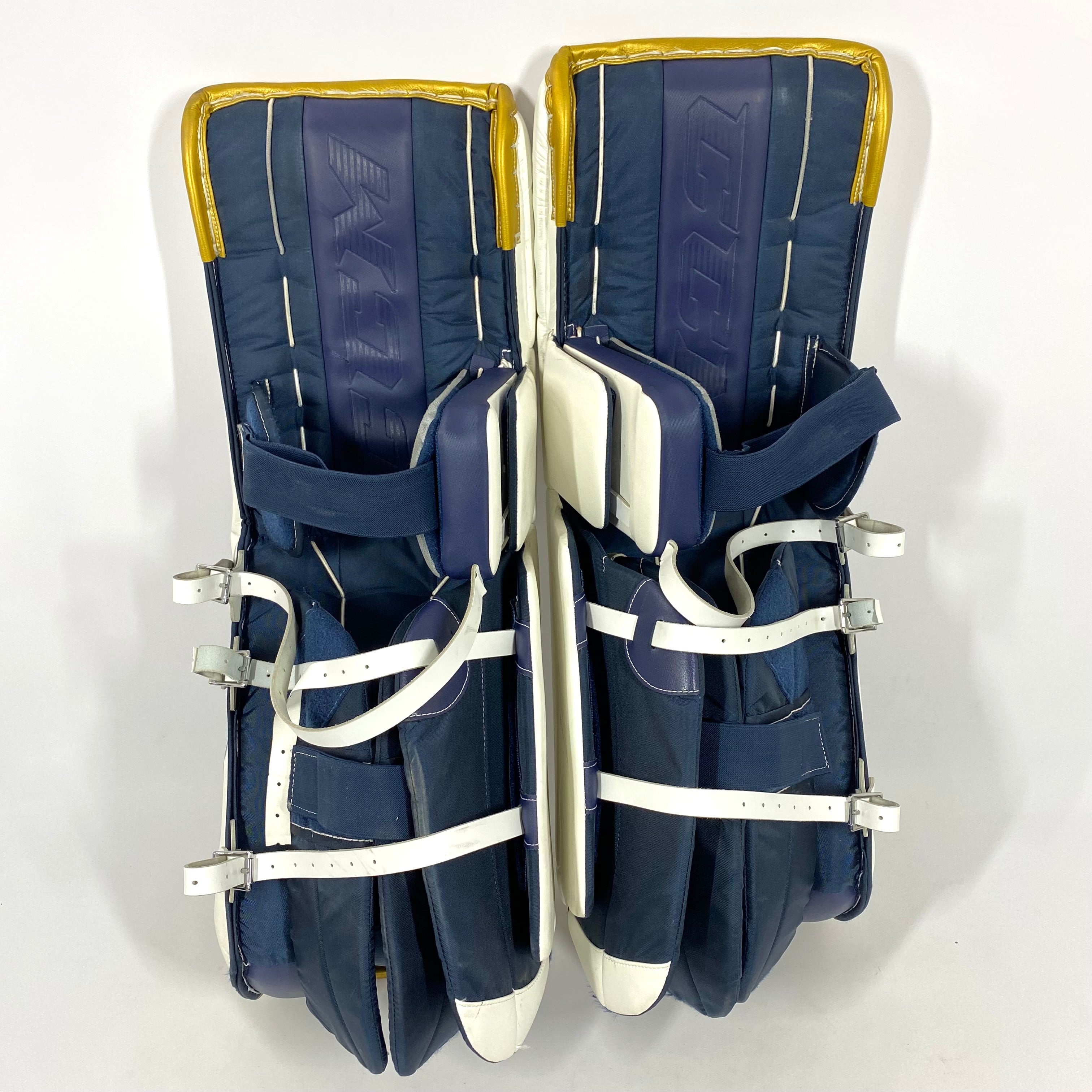 Extreme Flex 5 - Jambières de gardien NCAA Pro Stock d'occasion (blanc/bleu/or)